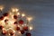 New Year template with red shiny, matte and sparkling christmas balls and garland of yellow led lights