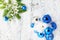 New year theme: Christmas tree, blue and silver balls, snow, snowflakes, serpentine