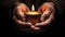 New Year themed image that conveys a sense of warmth and hope.Hands hold a candle in a tin with a floral design on a