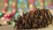 New Year video screensaver pine cone on the background of Christmas lights.