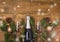 New Years Christmas Celebration Background with Pair of Wineglasses and Bottle of Champagne Christmas New Year Card Fir Decoration