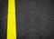 New yellow line on the road texture, asphalt as abstract background