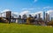 New York autumn skyline from Brookline side with view on the Brooklyn bridge. On forward the picnic place with green