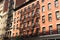 New York brick buildings with outside fire escape stairs