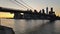 New York City Brooklyn Bridge over Hudson River with skyline after sunset night view illuminated with lights viewed