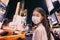 New York City COVID-19 Coronavirus cases. NYC Quarantine travel ban asian woman wearing face mask walking at night in