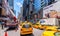 NEW YORK CITY - JUNE 2013: Yellow cabs speed up along city streets. There are more than 10000 taxis in New York