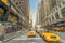 NEW YORK CITY - JUNE 8, 2013: Taxi speeds up along city street.