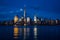 New York City Manhattan downtown skyline with skyscrapers illuminated over Hudson River panorama