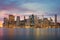 New York City - Manhattan skylines at evening time, great illumination and moody clouds, NYC, USA