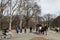 New York City, New York - March 24, 2019: People enjoying a sunny and warm day by taking a horse carriage ride in Central Park