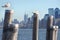 New York city skyline and pier poles with seagulls