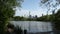 New York City Skyscrapers Tilt Down To Reveal Pond In Central Park