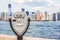 New York City tourism travel background tourist icon - coin operated binocular tower viewer with skyline view in summer