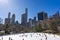 New York City, US - March, 31 2018: People ice skating in Wollman ice rink in New York during a sunny spring morning.