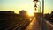 NEW YORK CITY, USA - OCTOBER 1, 2021: Elevated Line 7 Subway Train Departing from Station at Sunrise