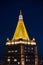 The New York Life building roof shines against the night with gold-leaf dipped terracotta tiles