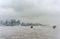 NEW YORK, NEW YORK - JANUARY 11, 2014: Hudson river in Winter with Misty New York Cityscape in Background.