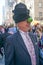 New York, New York: Man wearing black hats and a green apple