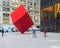 New York, NY / United States - Oct. 13, 2015: a landscape view of Red Cube. Red-painted steel cuboid public sculpture designed by