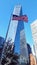 New York One World Trade Center Skyscraper and USA waving flag