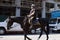 A New York police officer riding a horse around the street