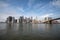 New york skyline reflection on the Hudson river at Brooklyn bridge at broad daylight