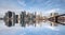 New york skyline reflection on the Hudson river at Brooklyn bridge at broad daylight