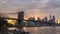 New york skyline reflection on the Hudson river at Brooklyn bridge at sunset