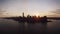 New York skyline skyscraper silhouette in warm sunset sky in aerial cityscape panorama