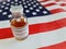 New york,United States of America 10 Jun 2022:A bottle of monkey pox vaccine (MPXV) placed on the United States flag.