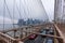 New York, US - March 29, 2018: People crossing the Brooklyn bridge