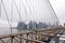 New York, US - March 29, 2018: People crossing the Brooklyn bridge