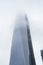 NEW YORK, US - NOVEMBER 22: New World Trade Centre building engulfed by low hanging clouds. November 22, 2013 in New York.