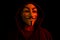 New York, USA - 22 april 2021: man wearing vendetta mask with hoodie on black background. This mask is symbol for Anonymous