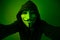 New York, USA - 22 april 2021: man wearing vendetta mask with hoodie on black background. This mask is symbol for Anonymous