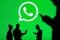 NEW YORK, USA, 25. MAY 2020: WhatsApp cross-platform messaging and Voice over service Group of business people chat on mobile