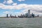 New York,USA-June 15 ,2018 :Look on the sailboat is cruising in New York harbor buildings of Manhattan island in the background