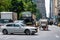 New York, USA - June 6, 2019:  Horse and carriage drives in traffic down Central Park West in Manhattan - image