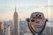 New york, USA - May 17, 2019: Binoculars looking at landmarks in midtown Manhattan, New York City