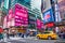 New York, USA. Times Square crowds and traffic in the evening near Subway Station.