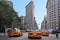 New York yellow taxi cabs rush through Fifth Avenue in Manhattan