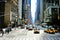 New York yellow taxi cabs rush through Sixth Avenue in Manhattan