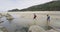 New Zealand beach travel vacation couple hiking in Abel Tasman National Park