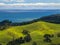 New Zealand erosion landscape green hills with sea