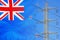 New Zealand flag on electric pole background. Increasing energy consumption, energy crisis in New Zealand. Price energy are