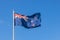 New Zealand Flag Flying In Blue Sky