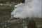 New Zealand geothermal power station with billowing steam