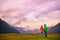 New Zealand hikers backpackers tramping on Routeburn Track, famous trail in the South Island of New Zealand. Couple