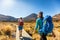 New Zealand Hiking Couple Backpackers Tramping At Tongariro National Park. Male and female hikers hiking by Mount